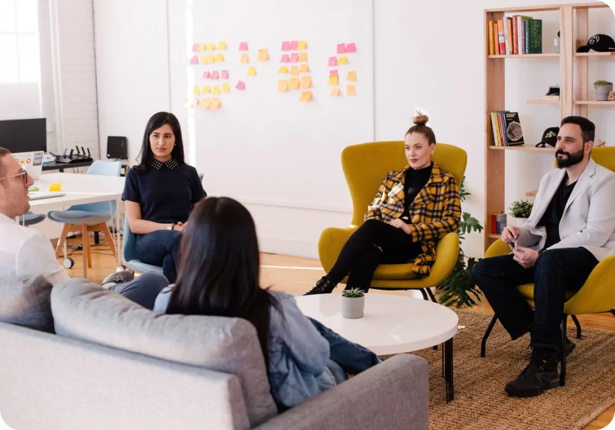 people sitting on couch at the meeting